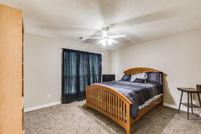 bedroom featuring visible vents, ceiling fan, carpet, and baseboards