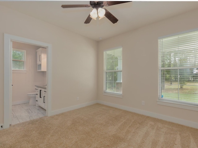 165 Sanctuary Rd, Huntsville, TX 77340 - spare room featuring baseboards, light carpet, and ceiling fan