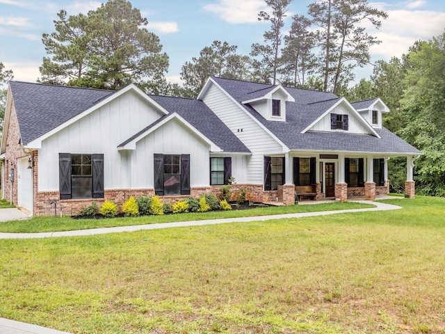 165 Sanctuary Rd, Huntsville, TX 77340 - view of front of home featuring a porch, board and batten siding, a front yard, and roof with shingles