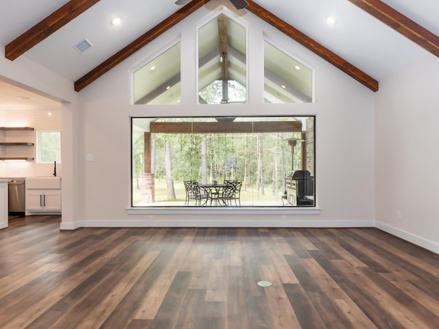 165 Sanctuary Rd, Huntsville, TX 77340 - unfurnished living room with beam ceiling, visible vents, dark wood-type flooring, and baseboards