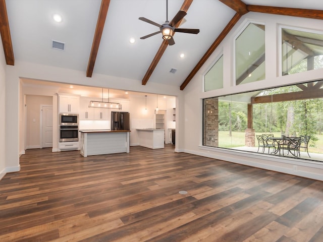165 Sanctuary Rd, Huntsville, TX 77340 - unfurnished living room featuring high vaulted ceiling and plenty of natural light