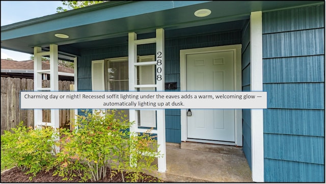 property entrance featuring fence and a porch