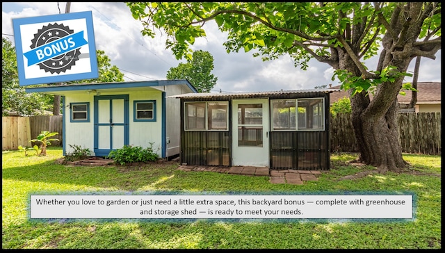 view of shed with fence