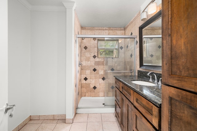 bathroom featuring crown molding, a stall shower, tile patterned floors, and vanity