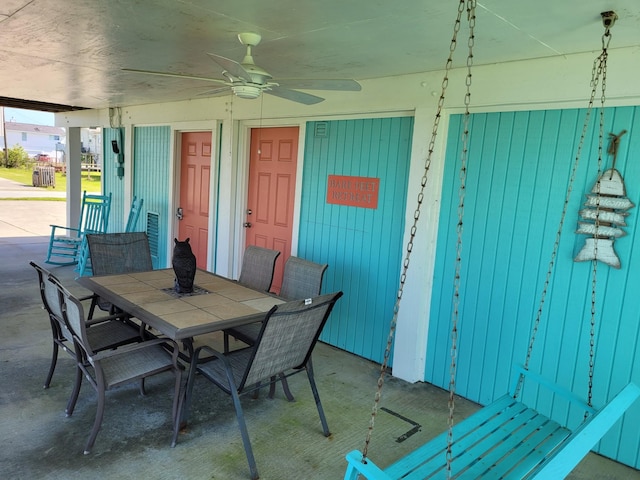16606 John Davis Rd, Jamaica Beach, TX 77554 - dining area with ceiling fan and concrete flooring