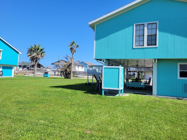 16606 John Davis Rd, Jamaica Beach, TX 77554 - view of yard with a ceiling fan, a patio area, and fence