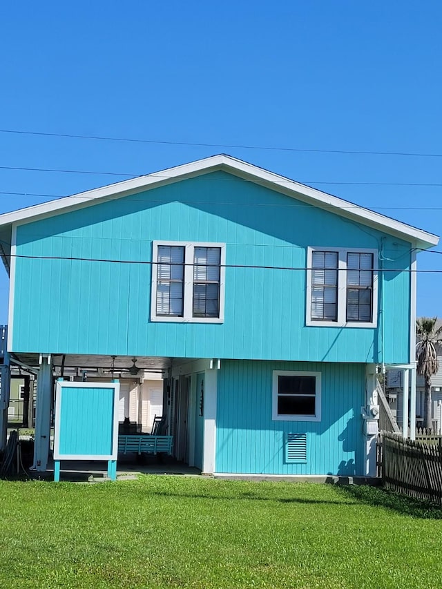 16606 John Davis Rd, Jamaica Beach, TX 77554 - rear view of property with fence and a yard