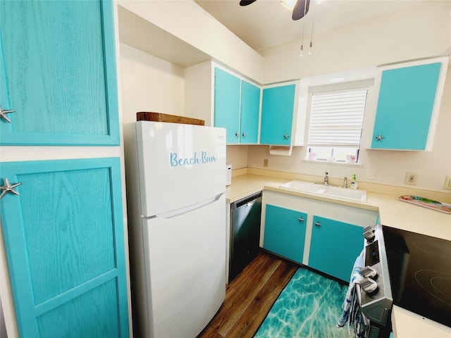 16606 John Davis Rd, Jamaica Beach, TX 77554 - kitchen featuring dark wood-style floors, a sink, a ceiling fan, dishwashing machine, and freestanding refrigerator