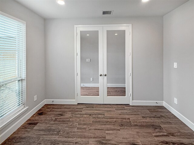 empty room featuring recessed lighting, visible vents, french doors, and plenty of natural light