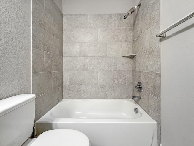 full bathroom with toilet and bathtub / shower combination