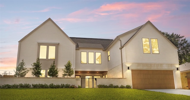 9302 Bassoon Dr, Houston, TX 77025 - view of front facade featuring driveway, a garage, a shingled roof, and stucco siding