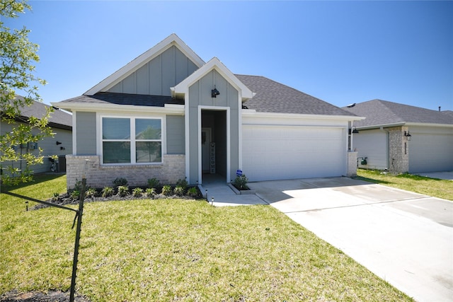 1219 Ricasoli Dr, Richmond, TX 77406 - view of front facade with a front lawn, a garage, driveway, board and batten siding, and brick siding