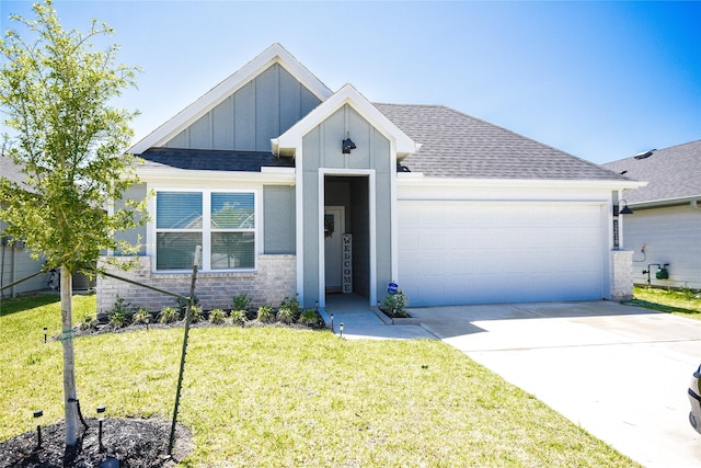 1219 Ricasoli Dr, Richmond, TX 77406 - view of front of home featuring roof with shingles, board and batten siding, a front yard, and an attached garage