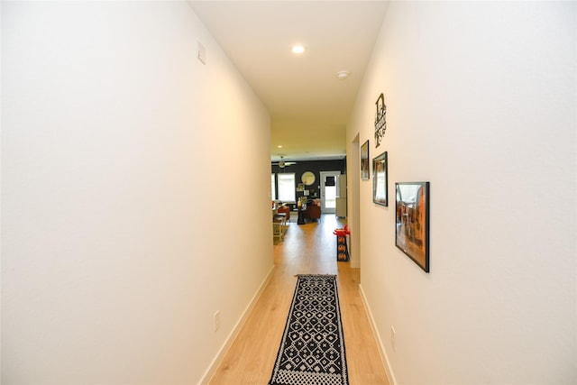 1219 Ricasoli Dr, Richmond, TX 77406 - corridor featuring recessed lighting, baseboards, and light wood-style floors