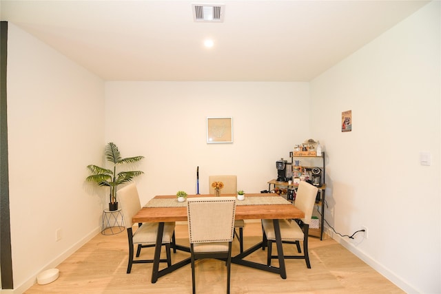 1219 Ricasoli Dr, Richmond, TX 77406 - dining area featuring visible vents, light wood-type flooring, and baseboards