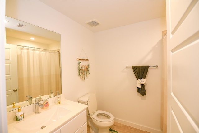 1219 Ricasoli Dr, Richmond, TX 77406 - full bathroom with baseboards, visible vents, toilet, and vanity