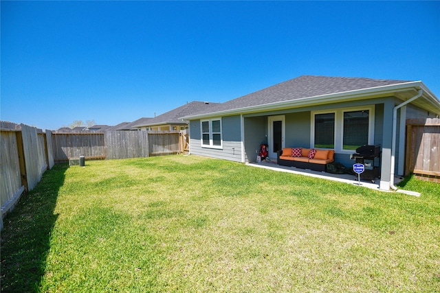 1219 Ricasoli Dr, Richmond, TX 77406 - rear view of property with a patio, a fenced backyard, outdoor lounge area, a lawn, and roof with shingles