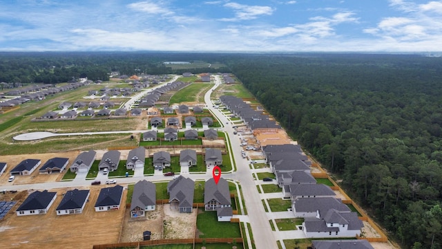 bird's eye view featuring a residential view and a forest view