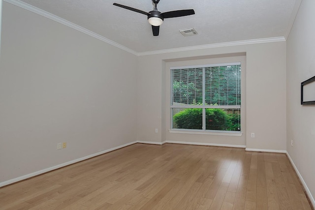 unfurnished room featuring a ceiling fan, baseboards, light wood-type flooring, and ornamental molding