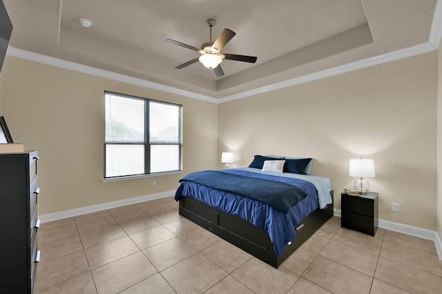 8107 Lockridge Terrace Ln, Cypress, TX 77433 - bedroom featuring baseboards, a raised ceiling, light tile patterned flooring, and crown molding