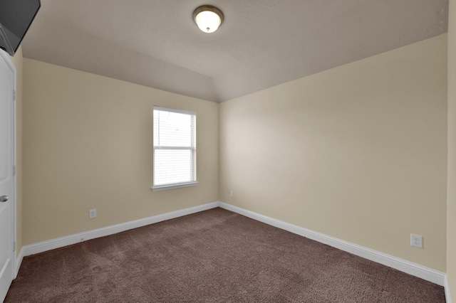 8107 Lockridge Terrace Ln, Cypress, TX 77433 - empty room with dark colored carpet, vaulted ceiling, and baseboards