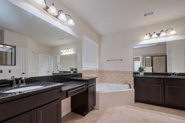 bathroom featuring visible vents, a bath, tile patterned floors, a shower stall, and a sink