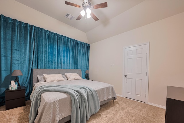 bedroom featuring ceiling fan, visible vents, vaulted ceiling, baseboards, and carpet flooring