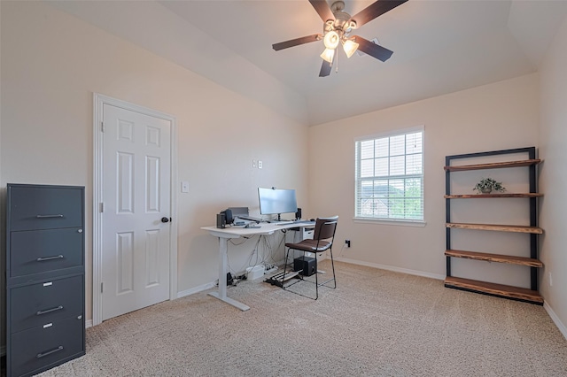 carpeted office space featuring ceiling fan, baseboards, and lofted ceiling