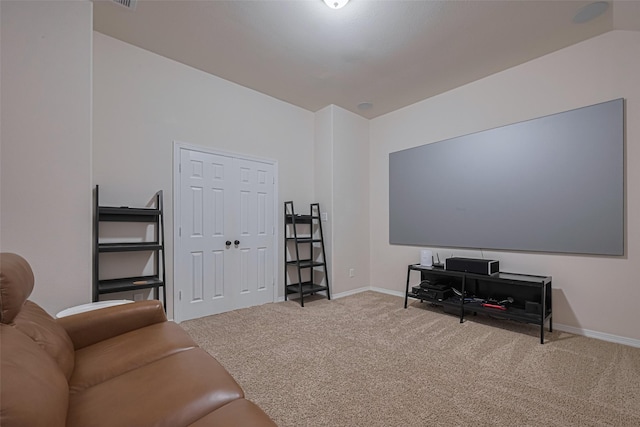 living room featuring carpet floors and baseboards