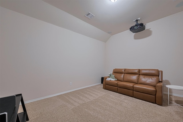 sitting room featuring vaulted ceiling, baseboards, carpet flooring, and visible vents
