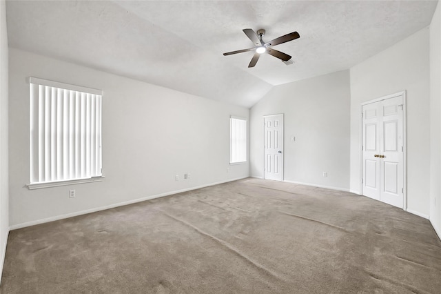 3006 Eagle Nest Ln, Humble, TX 77396 - carpeted spare room with a ceiling fan, lofted ceiling, and baseboards
