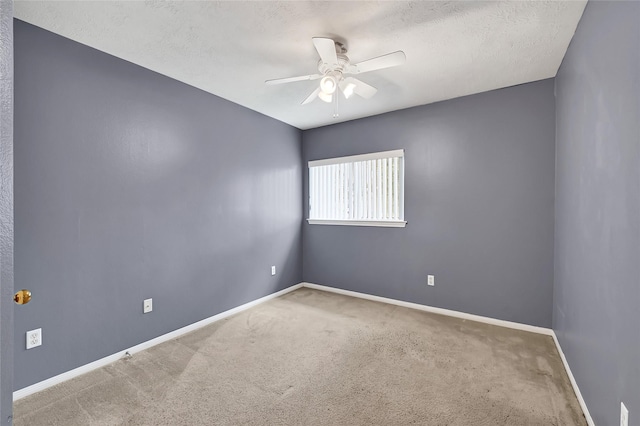 3006 Eagle Nest Ln, Humble, TX 77396 - carpeted spare room featuring a ceiling fan, baseboards, and a textured ceiling
