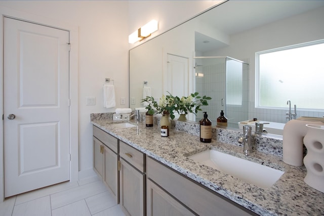 1546 W Tidwell Rd, Houston, TX 77091 - full bathroom with a shower stall, tile patterned floors, double vanity, and a soaking tub