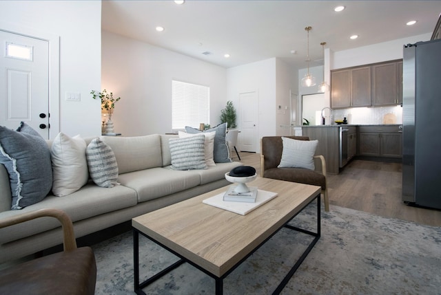 1546 W Tidwell Rd, Houston, TX 77091 - living room with light wood-style flooring and recessed lighting