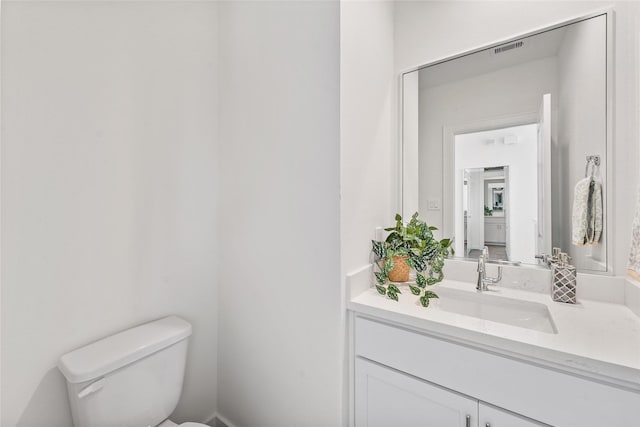 1207 Highland Vineyard Ln, Houston, TX 77091 - bathroom with toilet, visible vents, and vanity