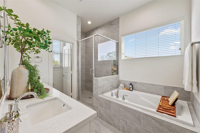 1207 Highland Vineyard Ln, Houston, TX 77091 - bathroom with a garden tub, vanity, and a stall shower