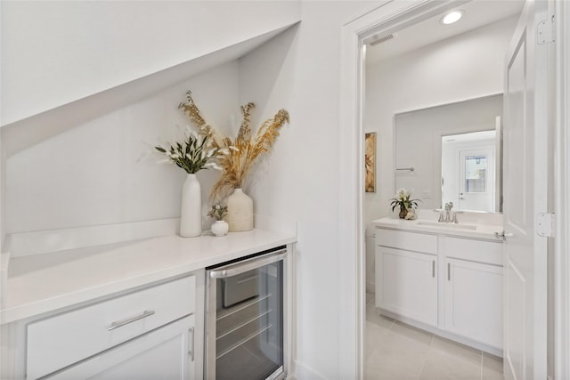 1207 Highland Vineyard Ln, Houston, TX 77091 - bar with recessed lighting, light tile patterned floors, a sink, visible vents, and wine cooler