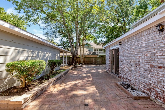 view of patio / terrace featuring fence