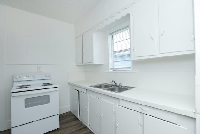 119 W Main St, Baytown, TX 77520 - kitchen with white cabinets, white electric range, light countertops, and a sink