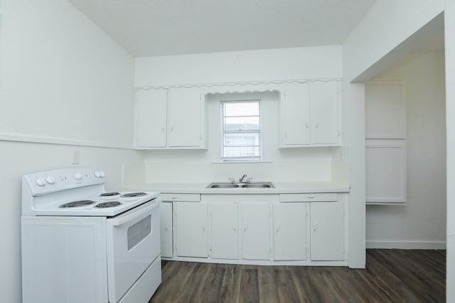 119 W Main St, Baytown, TX 77520 - kitchen featuring a sink, white electric range oven, dark wood-type flooring, light countertops, and white cabinets