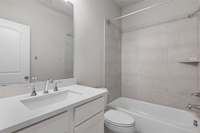 bathroom with vanity, toilet, and  shower combination