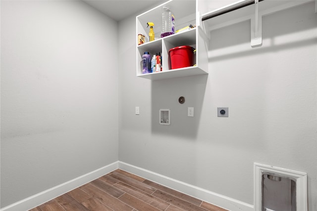 clothes washing area with hookup for an electric dryer, dark wood-style flooring, laundry area, hookup for a washing machine, and baseboards