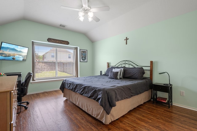 bedroom featuring lofted ceiling, baseboards, visible vents, and wood finished floors