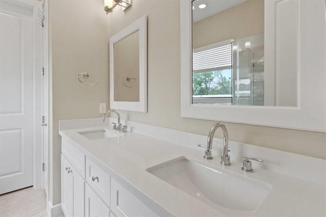 bathroom featuring double vanity and a sink