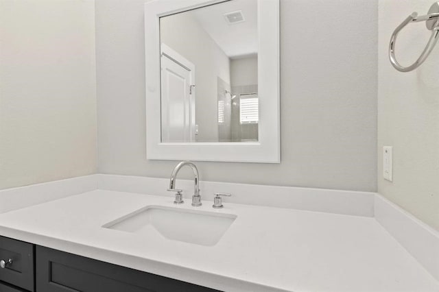 bathroom with visible vents and vanity