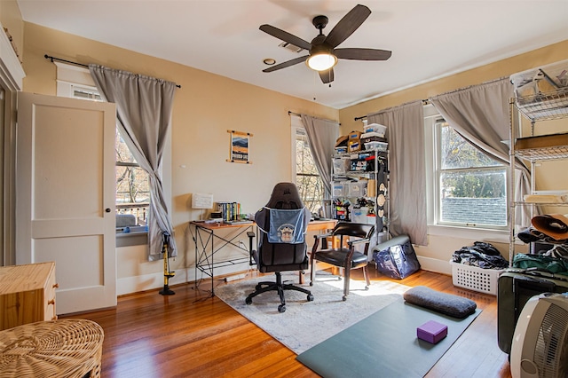 528 Hawthorne St, Houston, TX 77006 - office area with baseboards, wood finished floors, and a ceiling fan