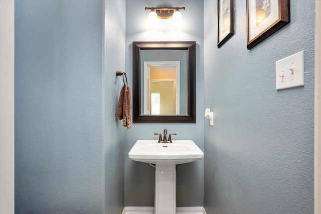 bathroom with a textured wall