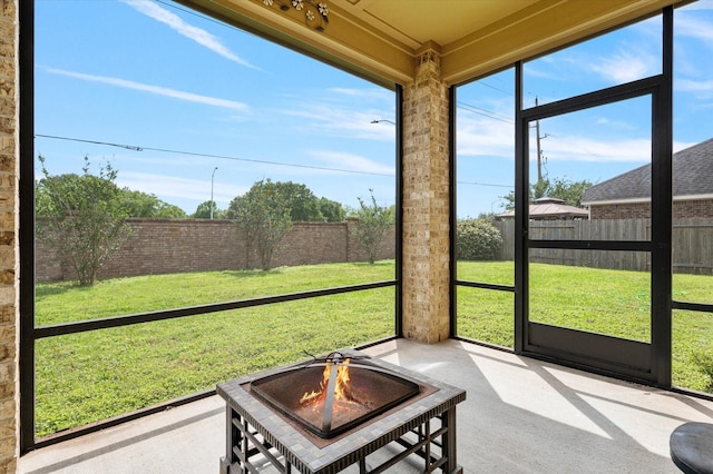 sunroom with a fire pit