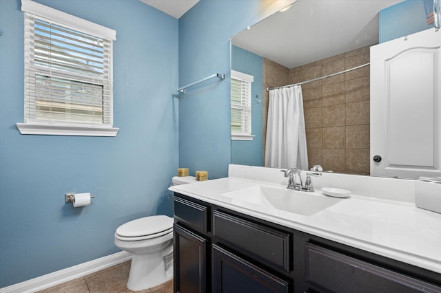 full bath featuring toilet, plenty of natural light, tile patterned flooring, and baseboards