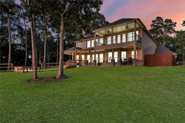 461 Pine Forest Acres Dr, Trinity, TX 75862 - back of house featuring a yard, a ceiling fan, and a balcony